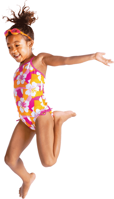 A smiling child in swimming clothes.