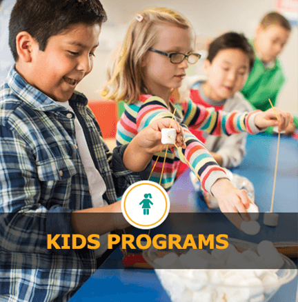 Children making crafts at a table